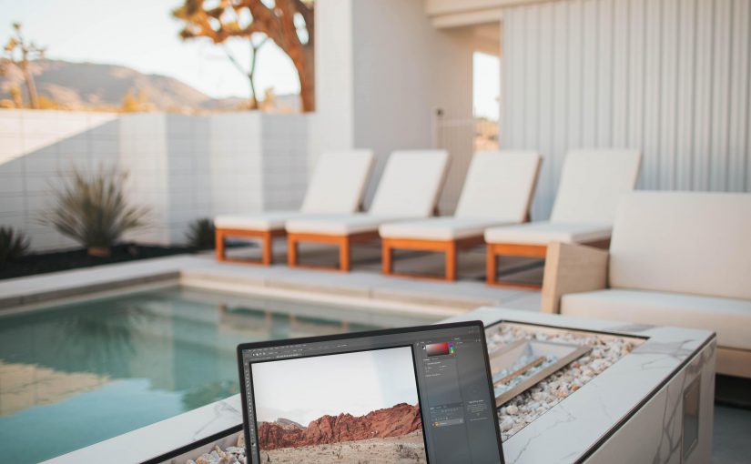 laptop near pool at desert villa